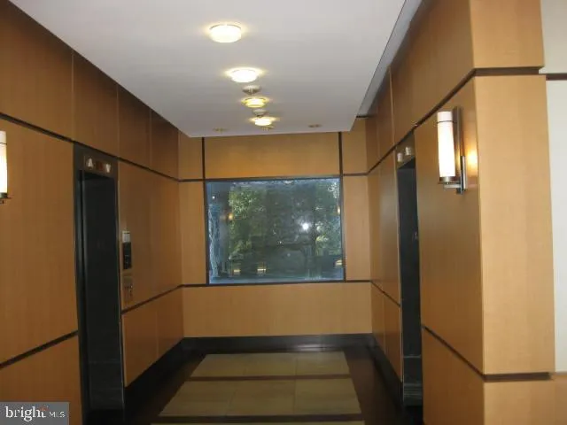a view of a lobby with black carpet