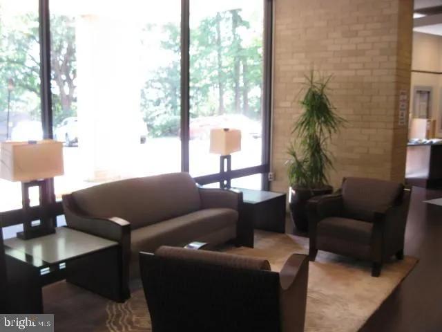 a view of empty room with chandelier fan