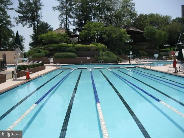 a view of swimming pool with sitting area