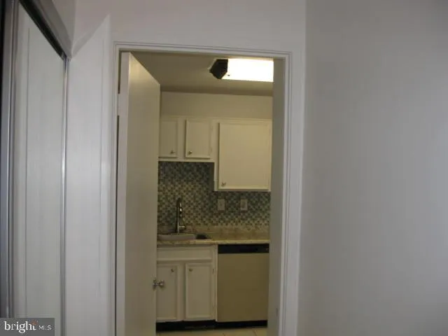 a view of a field of grass and trees