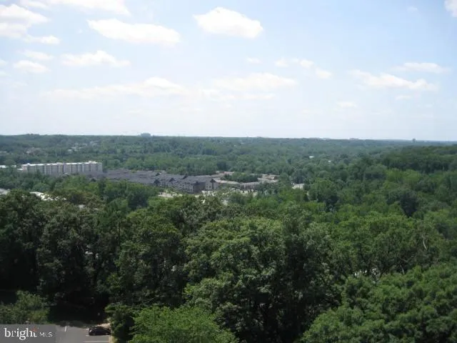 a bathroom with a mirror and a shower