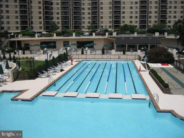 a view of swimming pool with outdoor seating