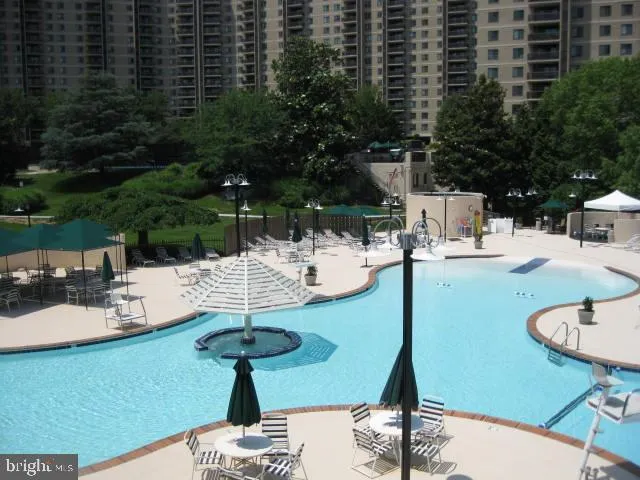 a view of a swimming pool with a patio