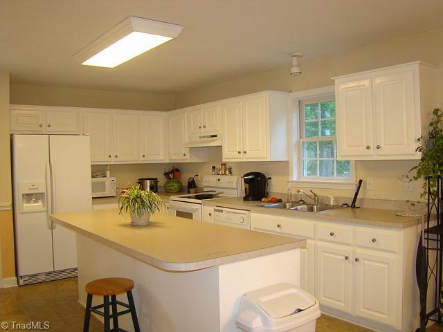 Kitchen. Eat-at bar, lots of cabinets