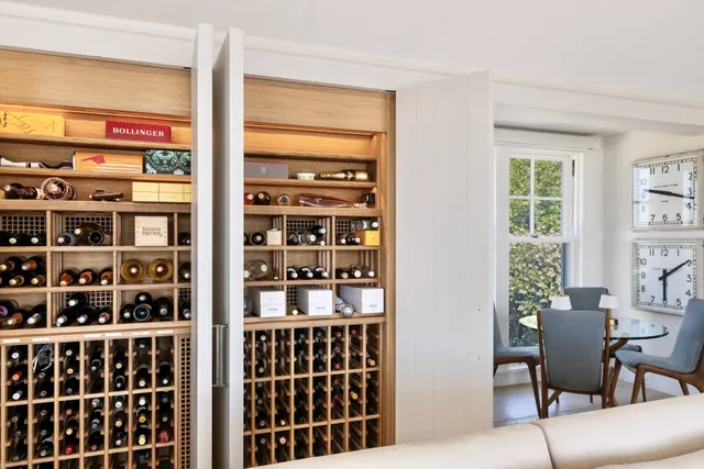 a living room with furniture a window and bookshelf