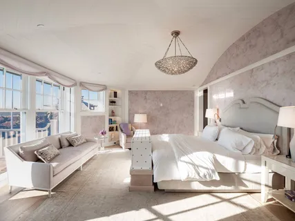 a living room with furniture chandelier and a view of kitchen chandelier