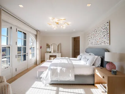 a bedroom with bed and window