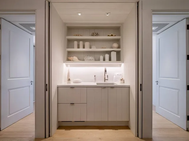 a view of cabinets and wooden floor