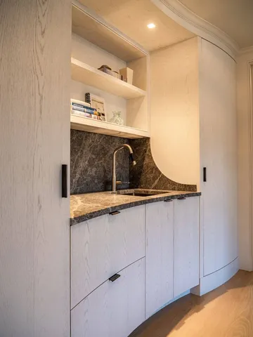 a bathroom with a sink and mirror