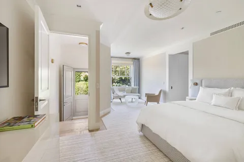 a bedroom with double bed and a window