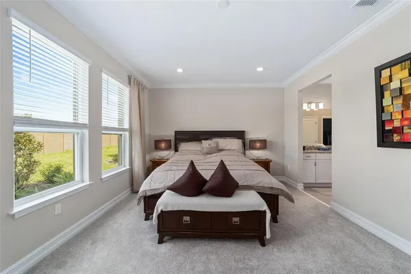 a bedroom with a bed and window