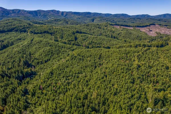 a view of mountain and a mountain in the background