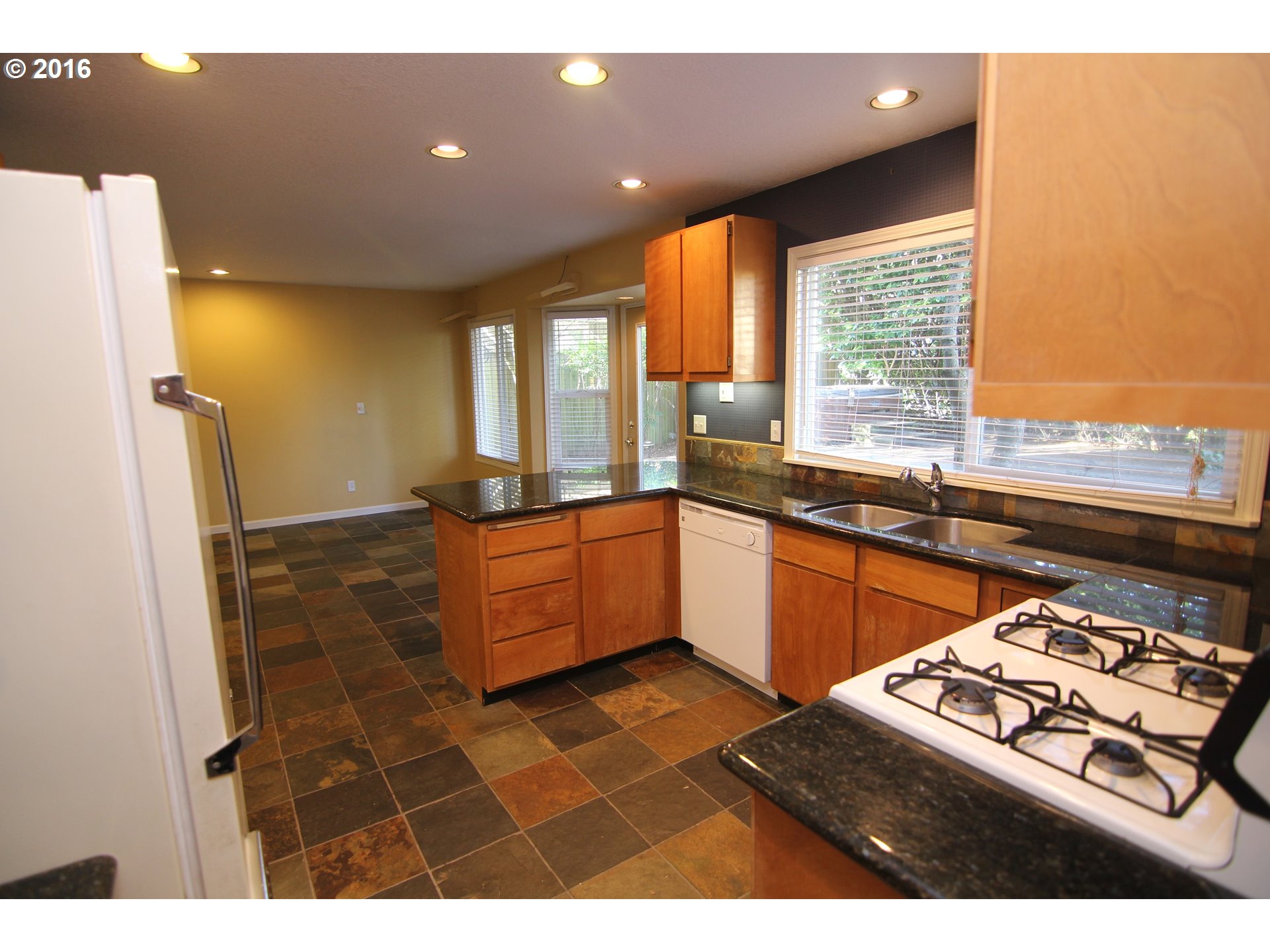 2525 Sunset Avenue West Linn, OR 97068 - Photo 7 of 25 a kitchen with a sink and a large window