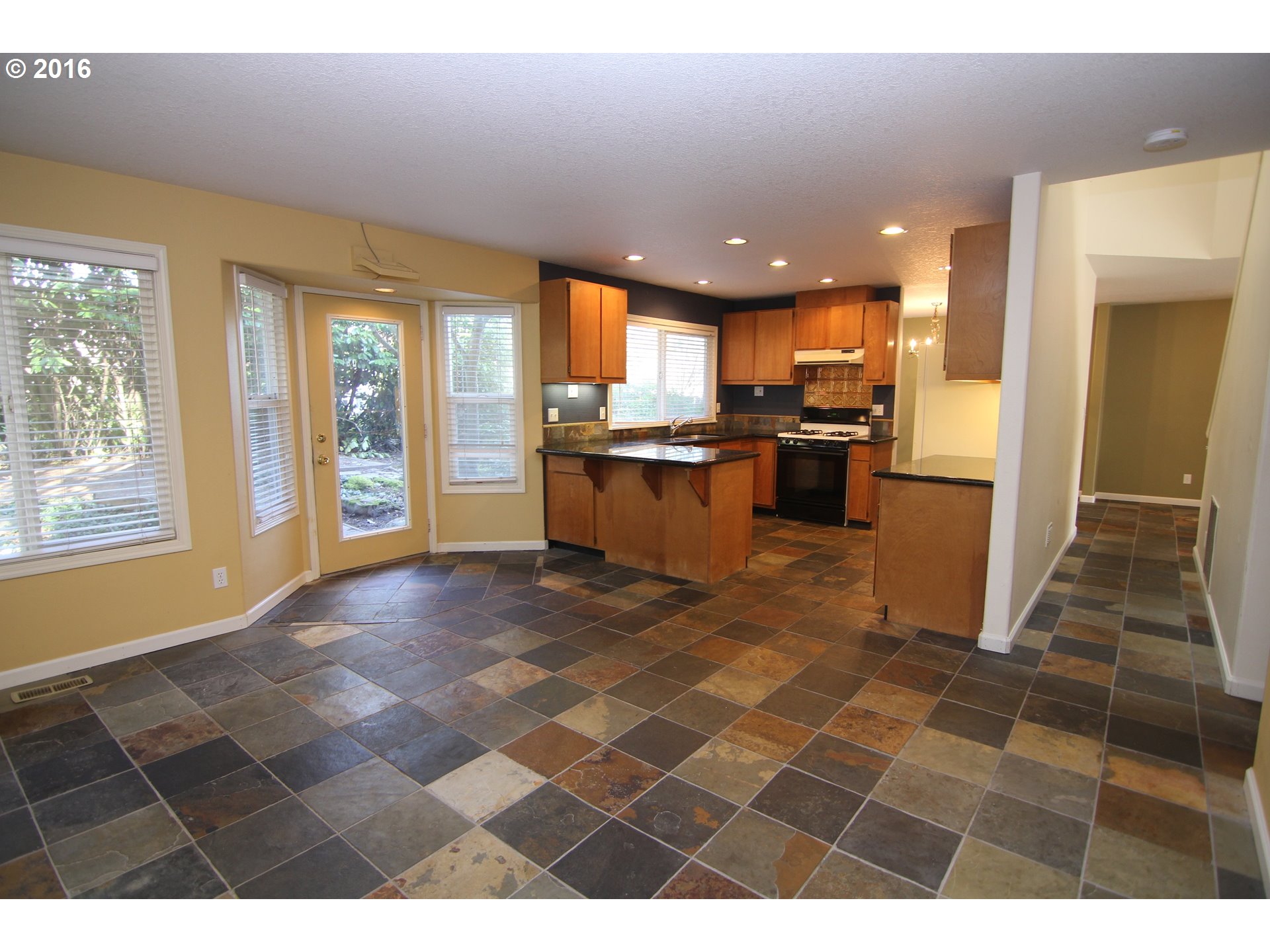 2525 Sunset Avenue West Linn, OR 97068 - Photo 10 of 25 a open kitchen with granite countertop a stove top oven a sink and a granite counter top
