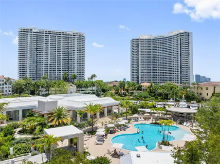 a front view of a house with a yard and outdoor seating