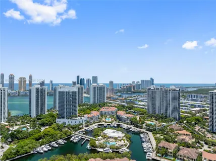 an aerial view of a house with outdoor space and sitting area