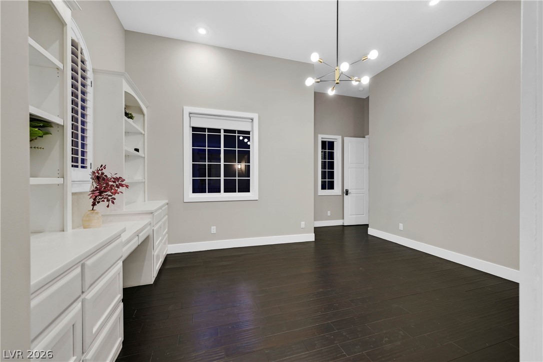 6 Rue Du Ville Henderson, NV 89011 - Photo 63 of 99 This versatile room features built-in shelving, rich hardwood floors, and elegant recessed lighting.