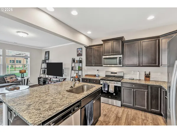 a kitchen with lots of counter top space sink and appliances