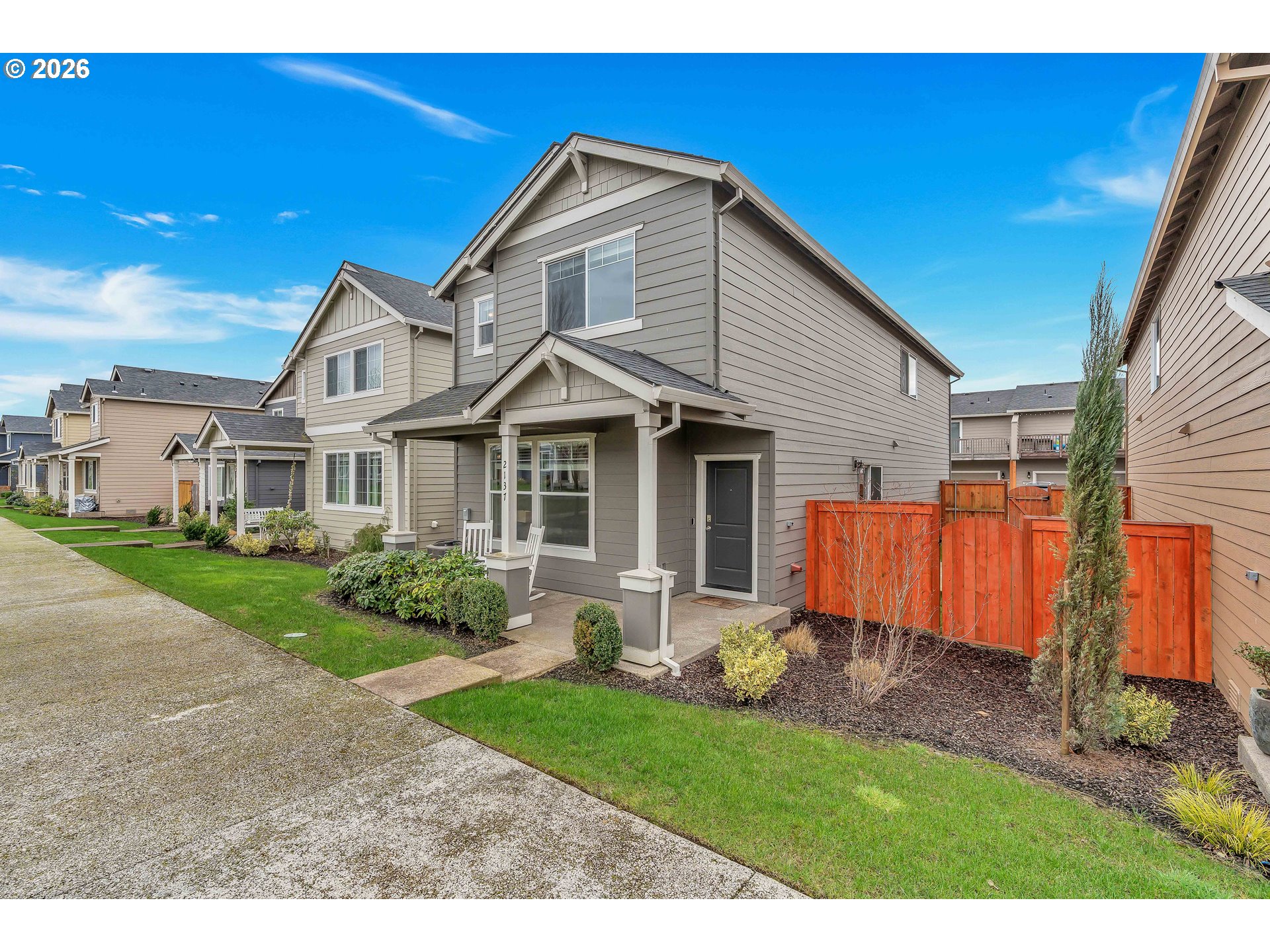 2137 Southeast 15th Alley Gresham, OR 97080 - Photo 2 of 44 a front view of a house with a yard