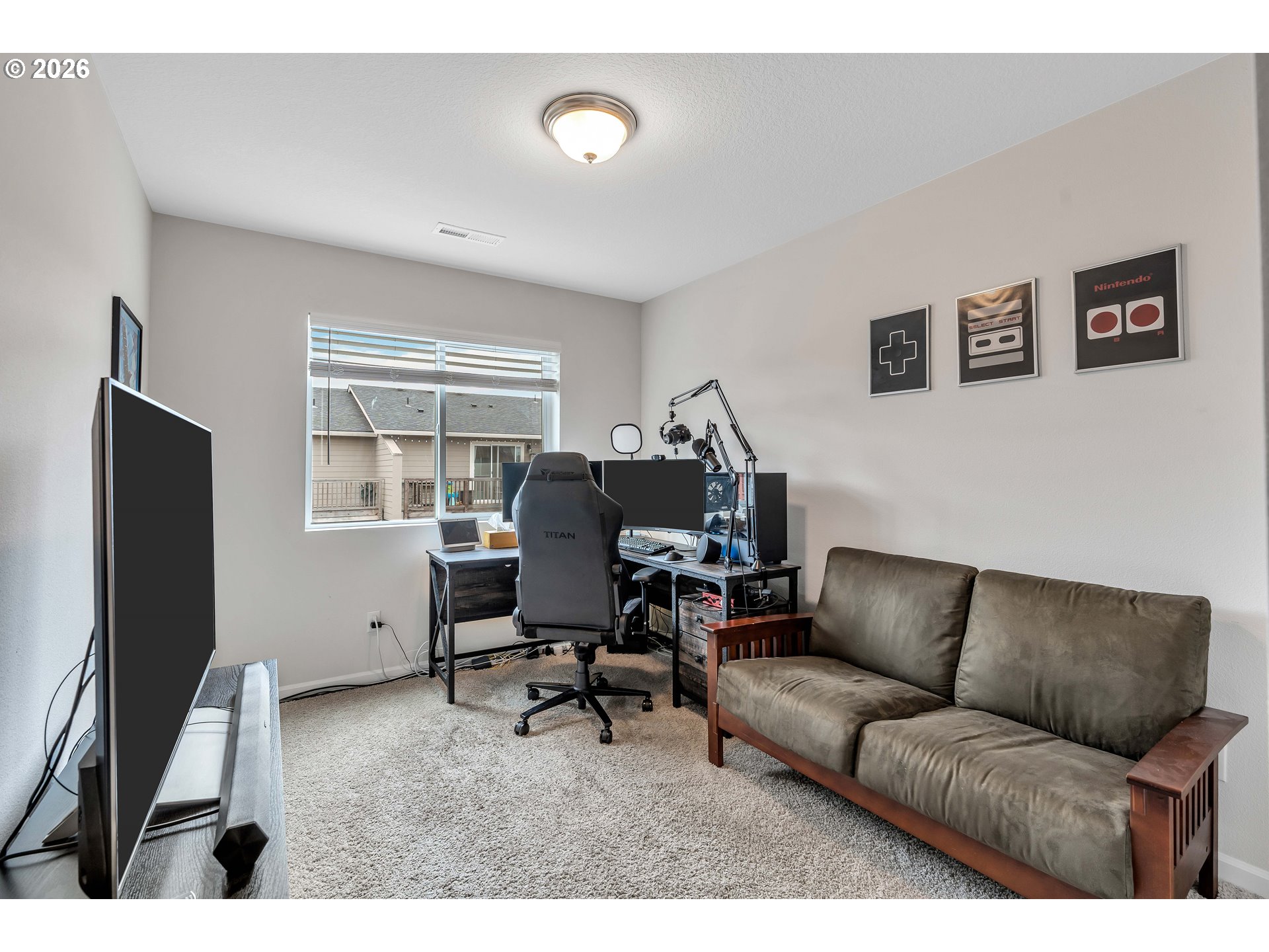 2137 Southeast 15th Alley Gresham, OR 97080 - Photo 22 of 44 a living room with furniture and a flat screen tv