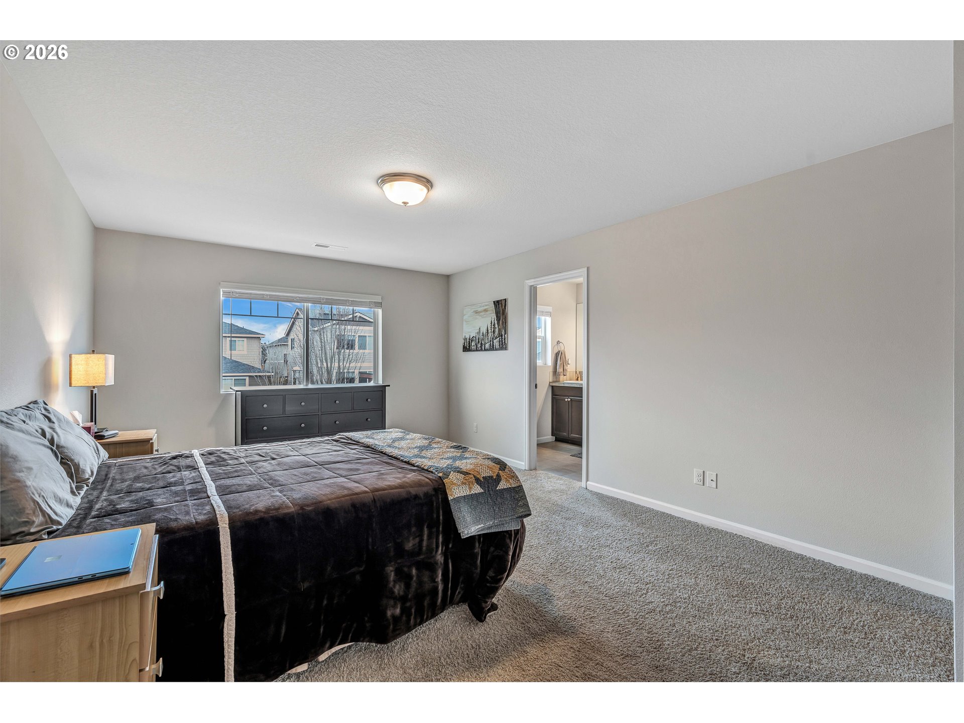 2137 Southeast 15th Alley Gresham, OR 97080 - Photo 24 of 44 a bedroom with a bed and wooden floor
