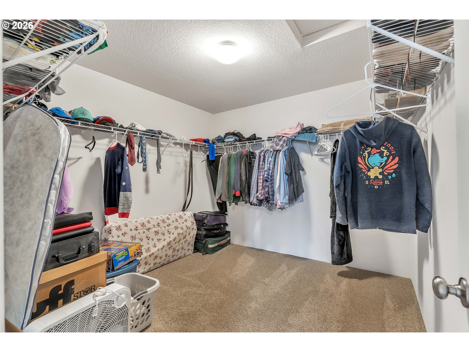 2137 Southeast 15th Alley Gresham, OR 97080 - Photo 27 of 44 a view of walk in closet with clothes and shoes