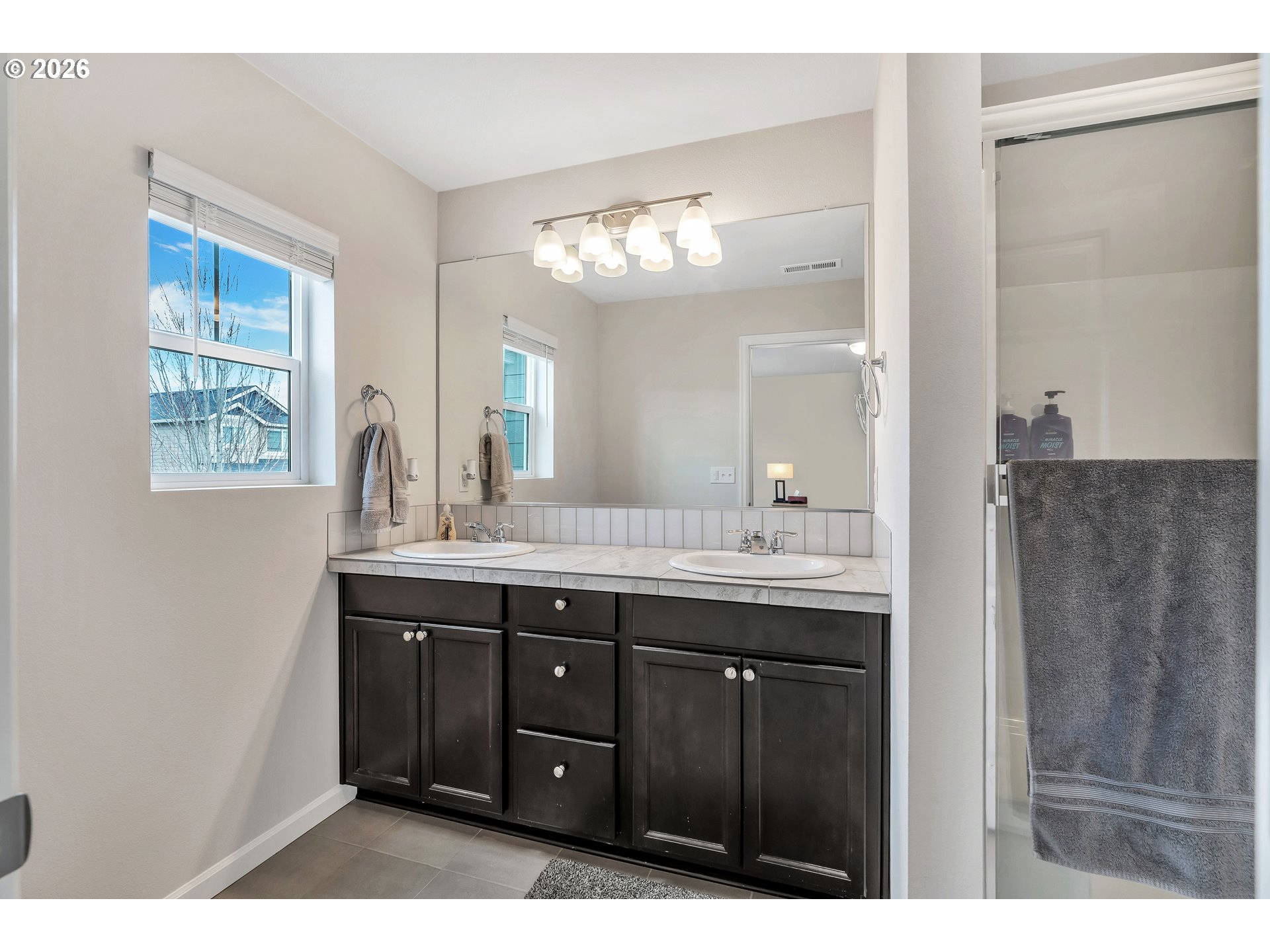 2137 Southeast 15th Alley Gresham, OR 97080 - Photo 28 of 44 a bathroom with a double vanity sink and a mirror