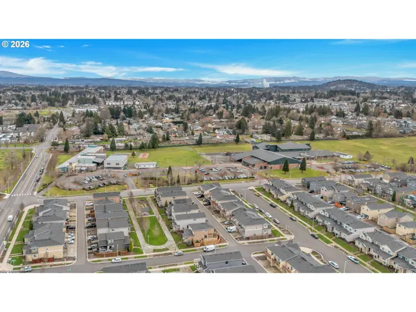 a black and white building with a view of the background