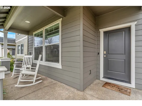 a room with wooden floor and windows