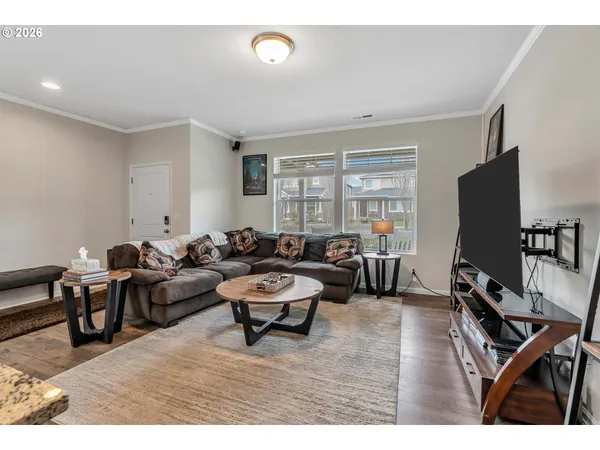 a living room with lots of furniture and a flat screen tv
