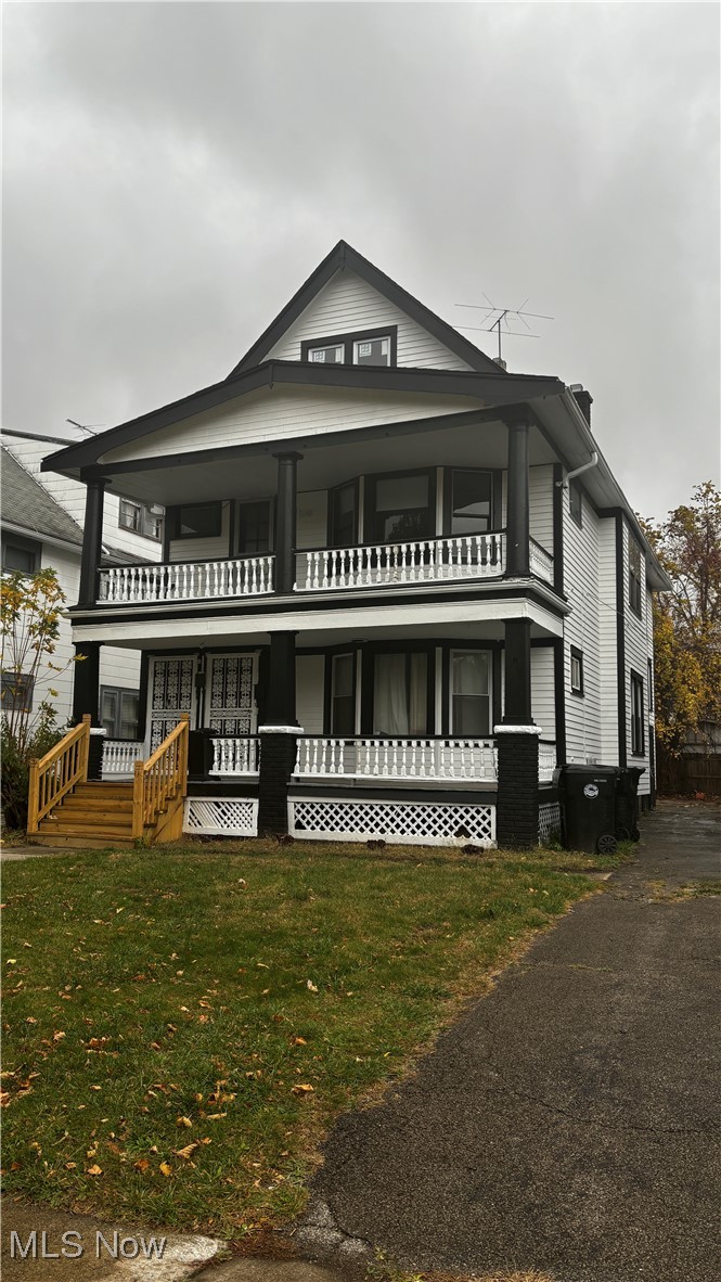 13421 Ashburton Road Cleveland, OH 44110 - Photo 1 of 28 View of front facade featuring a front lawn and a balcony