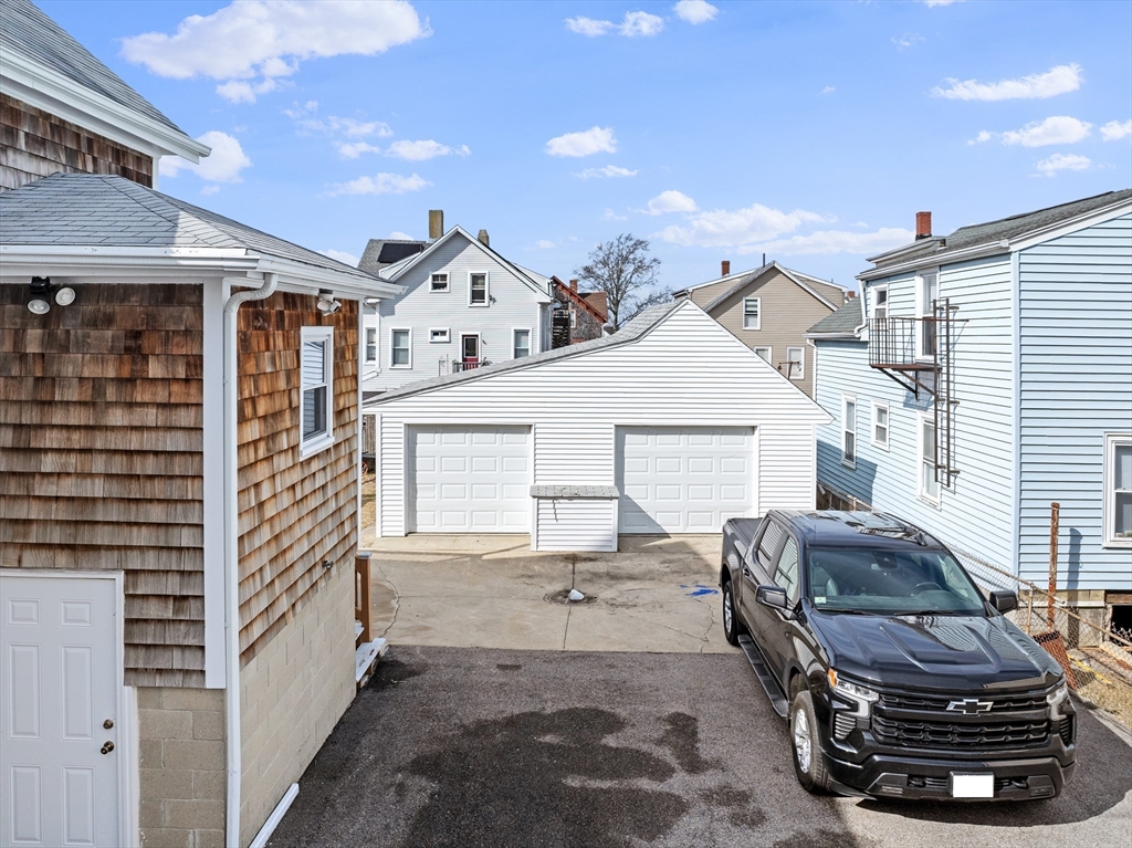 173 Whipple Street Fall River, MA 02721 - Photo 36 of 41 a view of a white house and a car parked in front of it