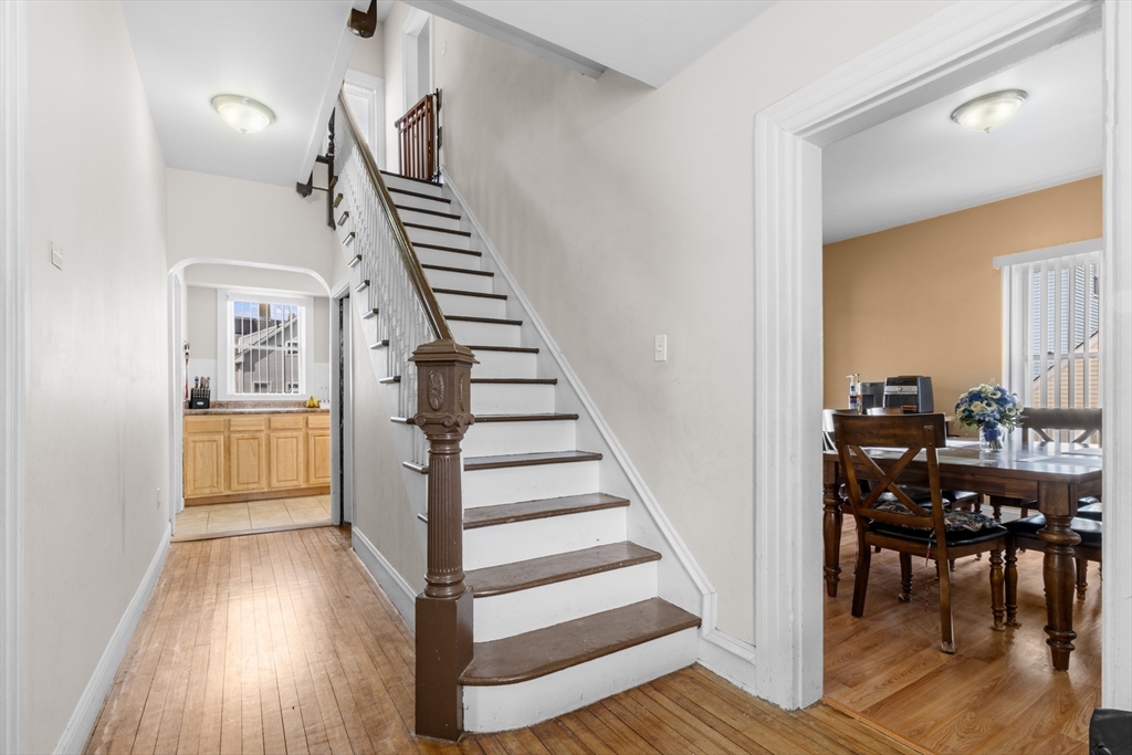 173 Whipple Street Fall River, MA 02721 - Photo 4 of 41 a view of a hallway with wooden floor and entryway