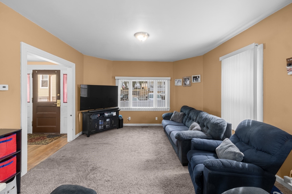 173 Whipple Street Fall River, MA 02721 - Photo 8 of 41 a living room with furniture and a flat screen tv
