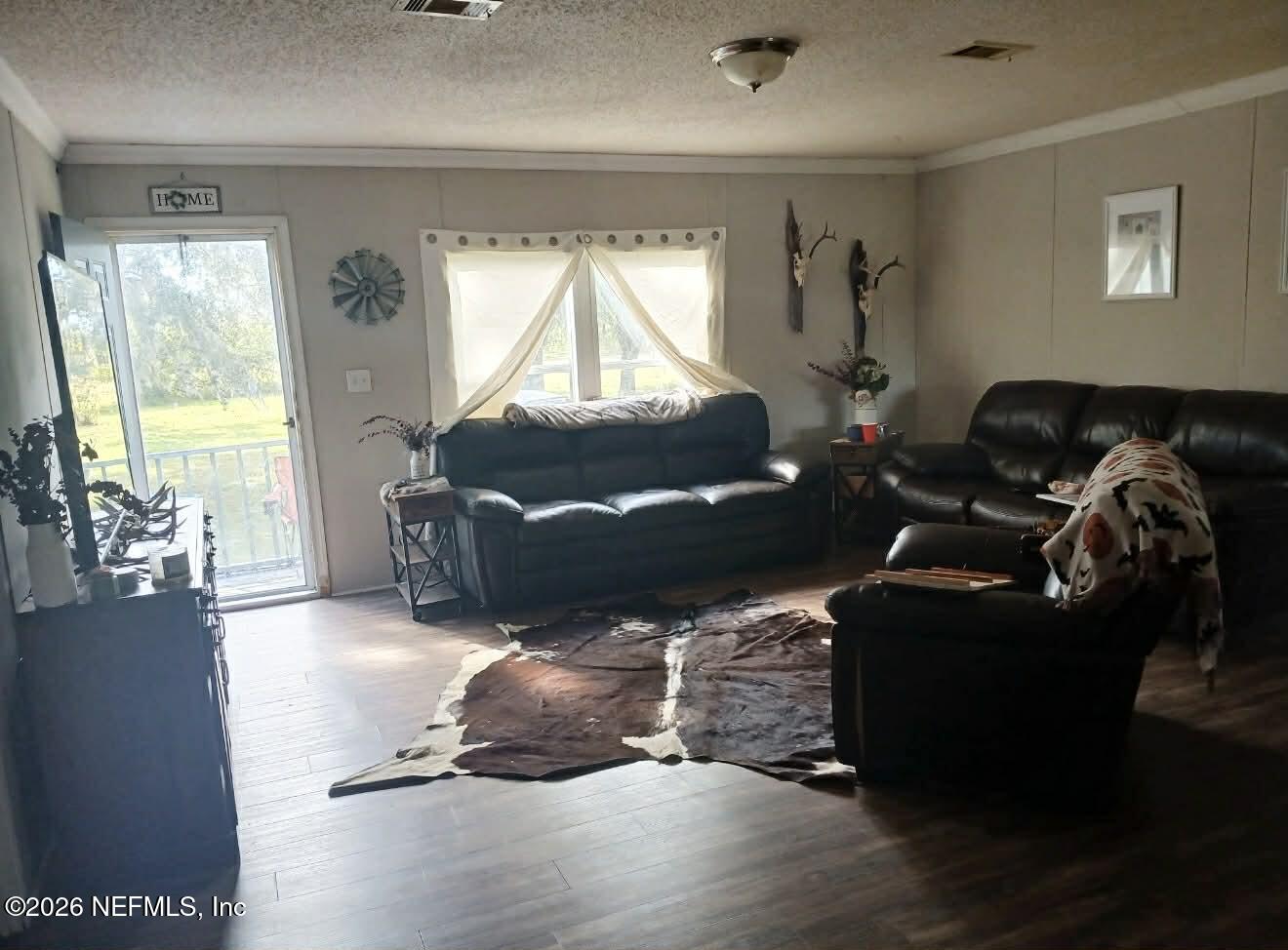 1670 Dennis Howell Road Perry, FL 32348 - Photo 14 of 15 a living room with furniture window and a flat screen tv