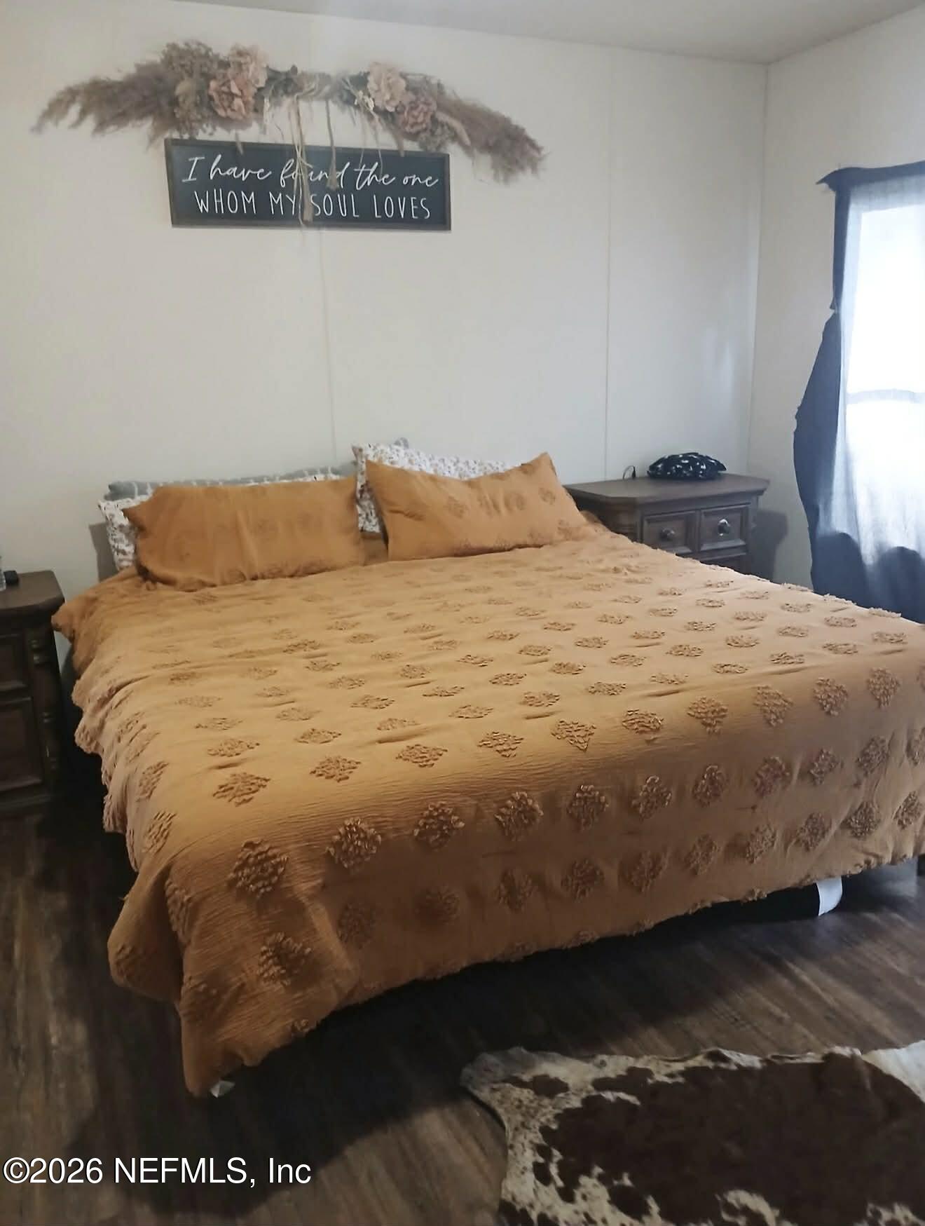 1670 Dennis Howell Road Perry, FL 32348 - Photo 8 of 15 a bedroom with a bed and dresser