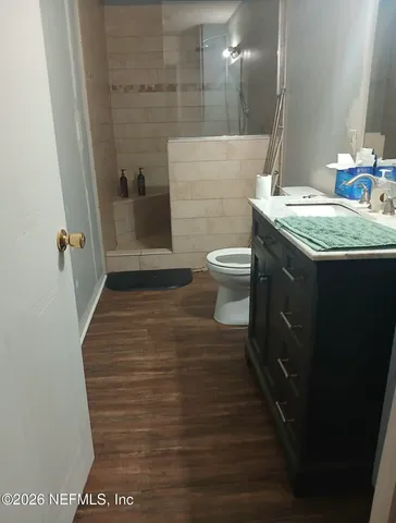a bathroom with a sink and toilet