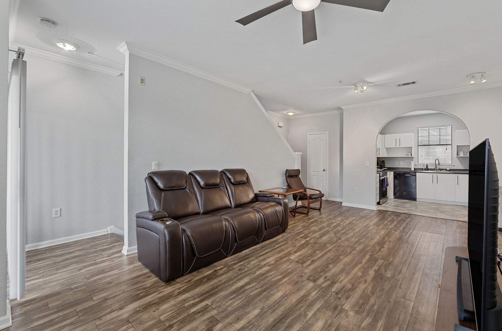 11203 Ranch Road 2222, Unit 905 Austin, TX 78732 - Photo 11 of 27 a living room with furniture and a wooden floor