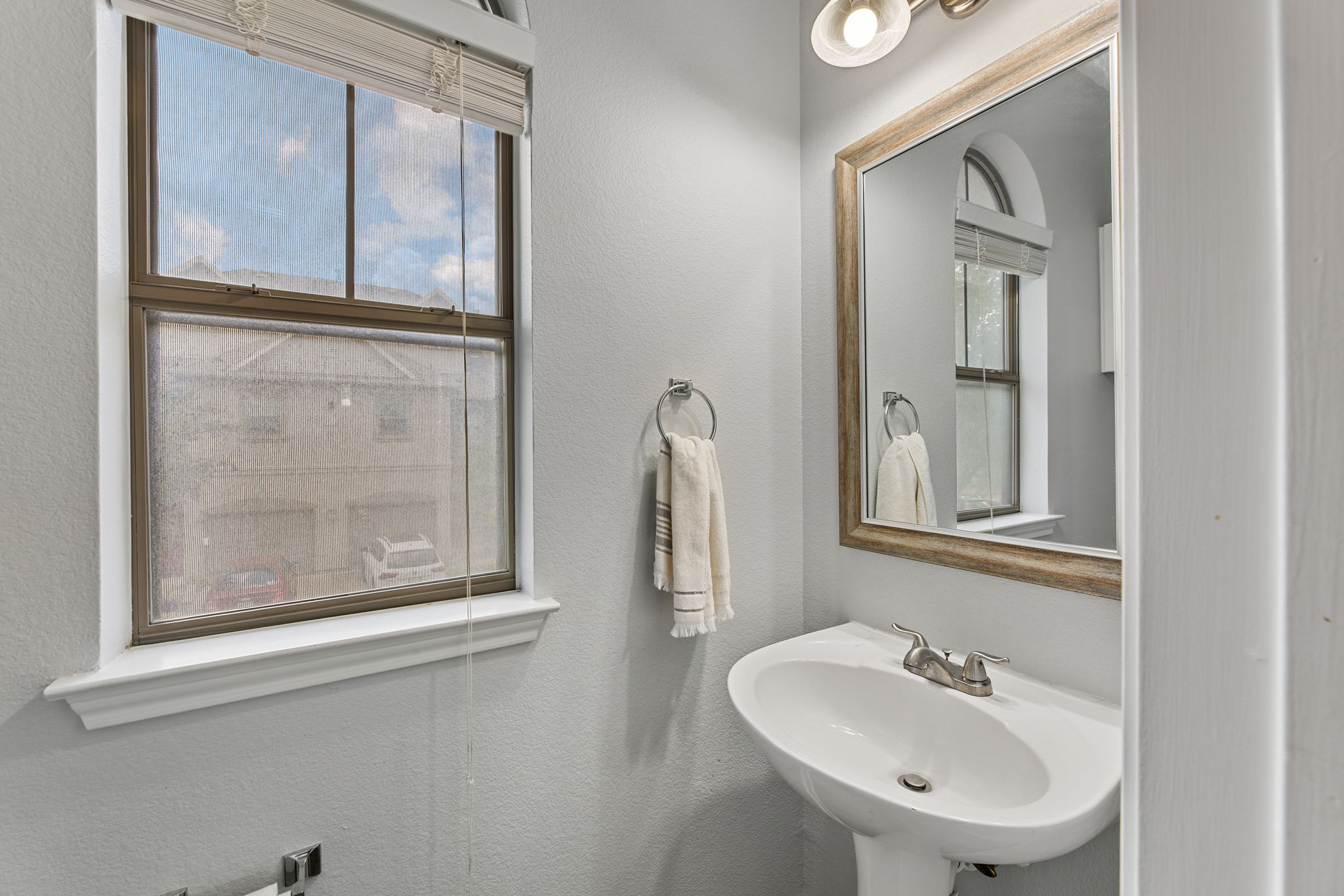 11203 Ranch Road 2222, Unit 905 Austin, TX 78732 - Photo 20 of 27 a bathroom with a sink and a mirror