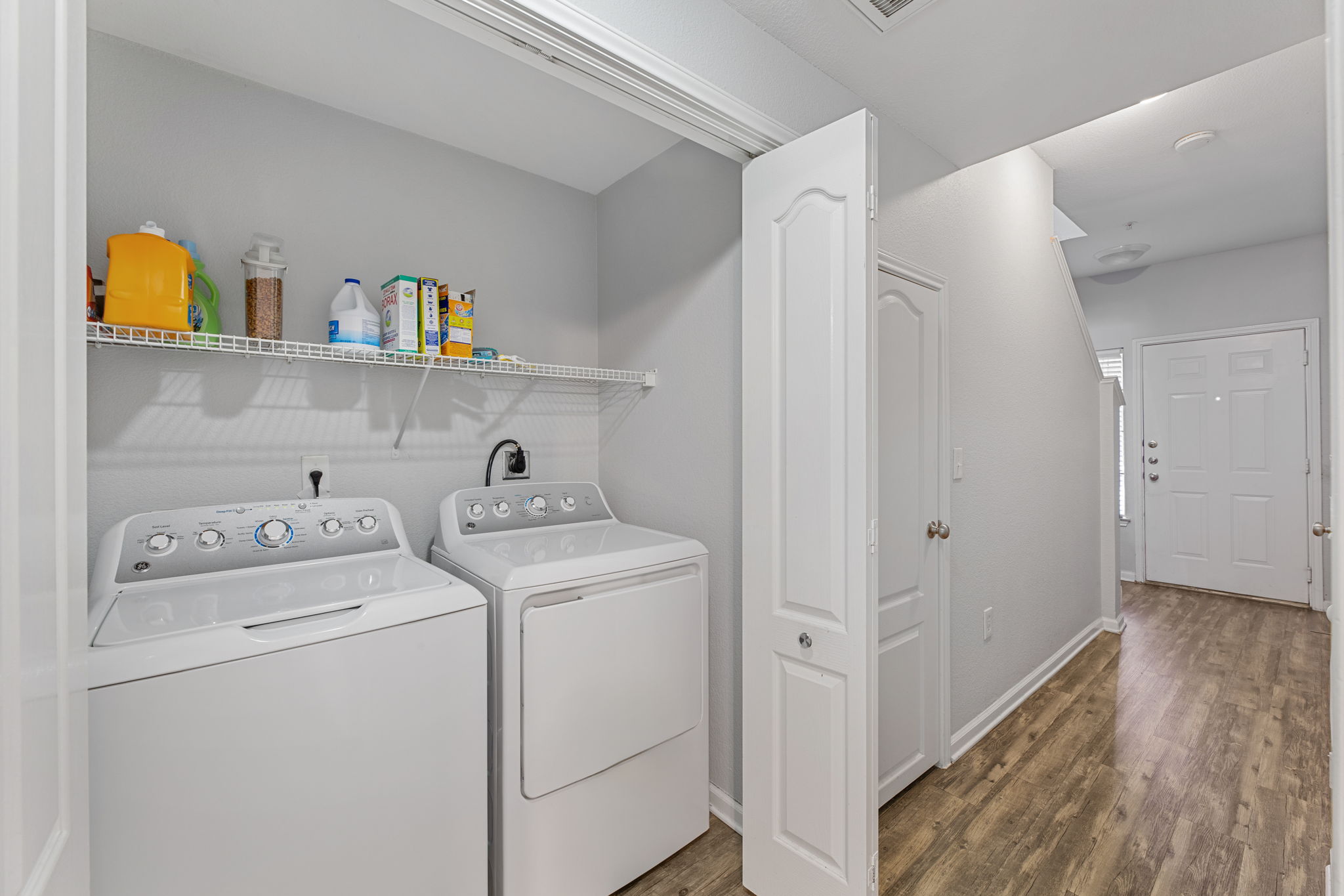 11203 Ranch Road 2222, Unit 905 Austin, TX 78732 - Photo 6 of 27 a view of storage and utility room with washer and dryer