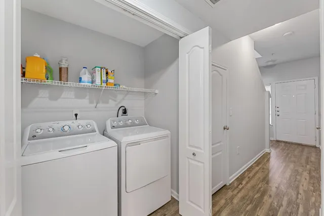 a view of storage and utility room with washer and dryer
