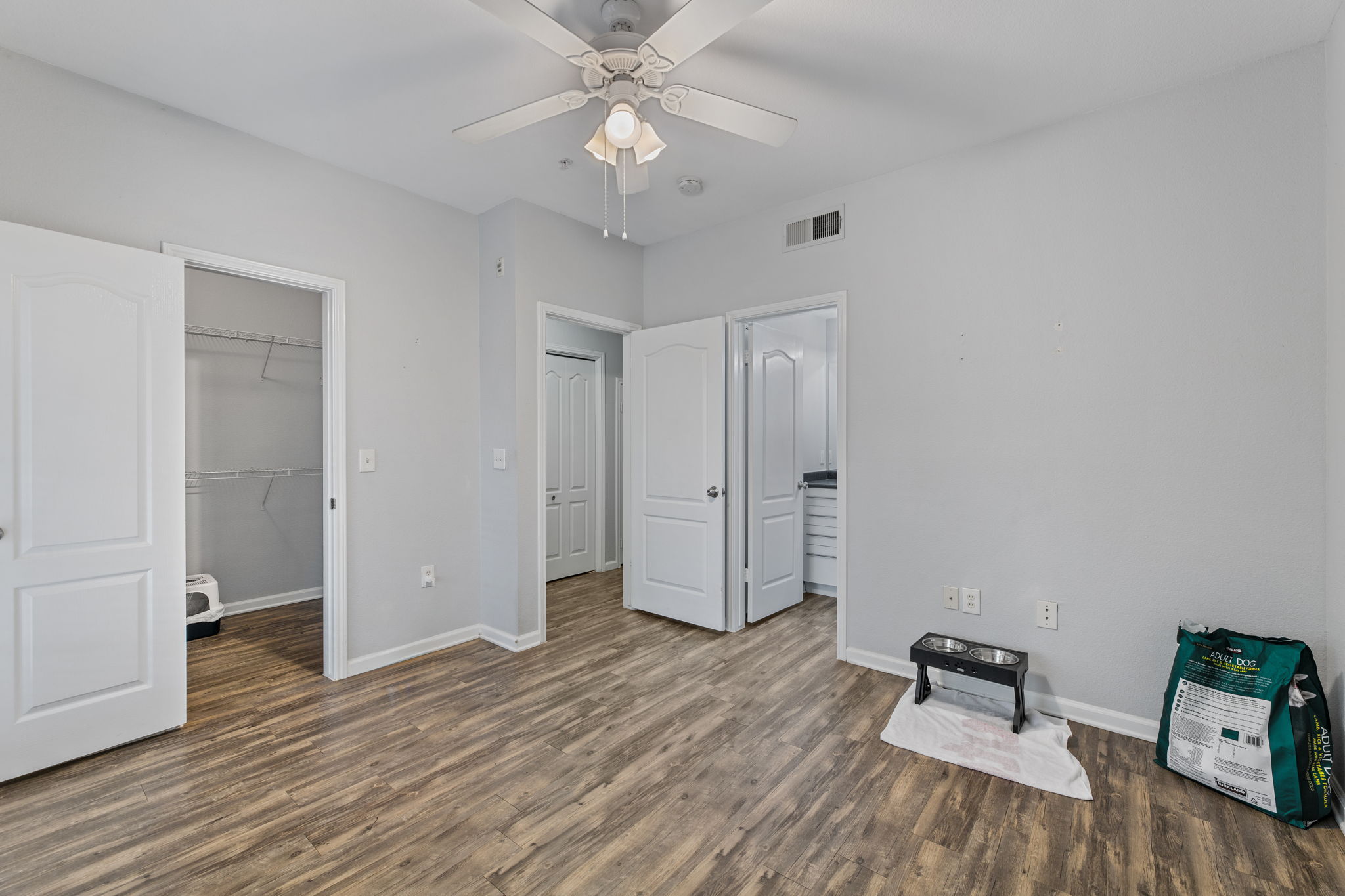 11203 Ranch Road 2222, Unit 905 Austin, TX 78732 - Photo 7 of 27 a view of room with hardwood floor and ceiling fan
