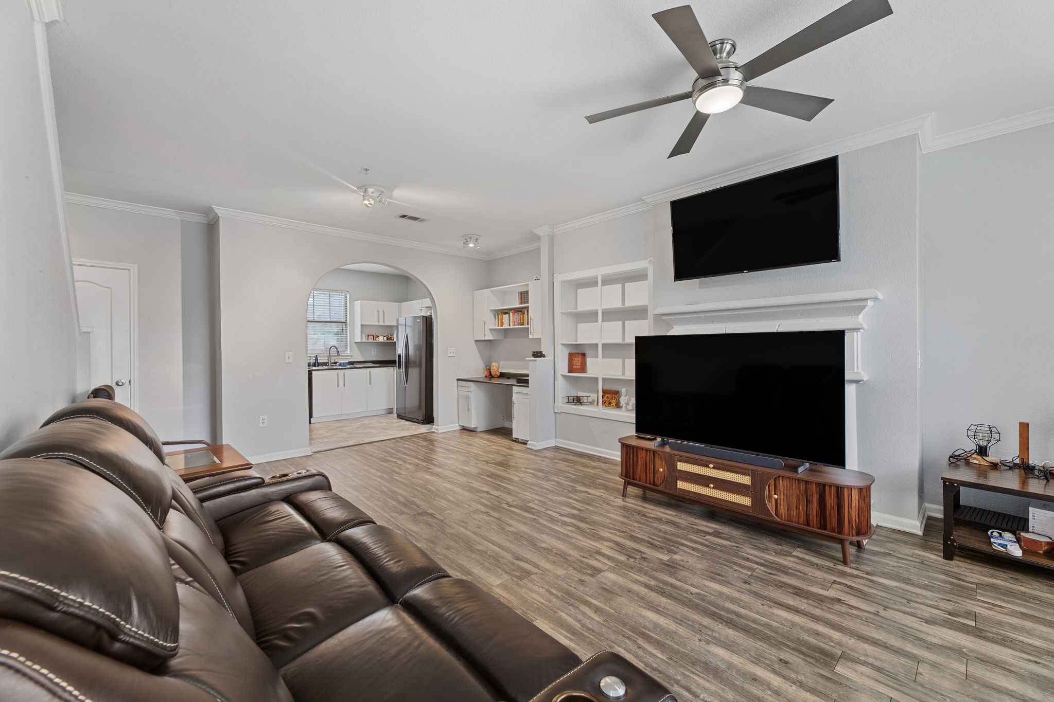11203 Ranch Road 2222, Unit 905 Austin, TX 78732 - Photo 10 of 27 a living room with furniture and a flat screen tv