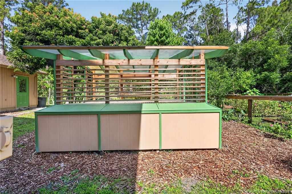 11145 Southwest Meadowlark Circle Stuart, FL 34997 - Photo 49 of 107 Custom Greenhouse with irrigation and storage