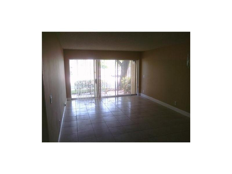 8977 Wiles Road, Unit 1052 Coral Springs, FL 33067 - Photo 6 of 8 a picture of wall with window