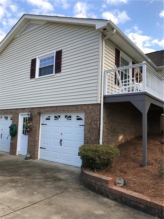 230 Hicks Road Lexington, NC 27295 - Photo 3 of 30 2 garage bays with new garage doors, door openers and key pad.