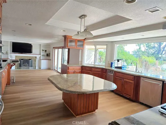 a large kitchen with kitchen island a large island in the center