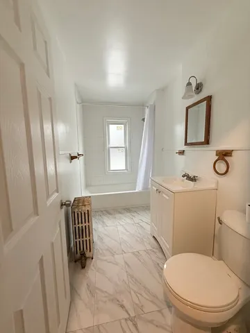 a bathroom with a toilet and a sink