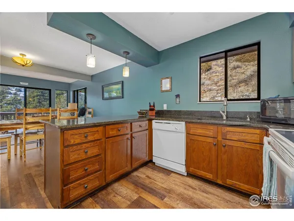 a large bathroom with double vanity sink a two mirror a window and a bathtub