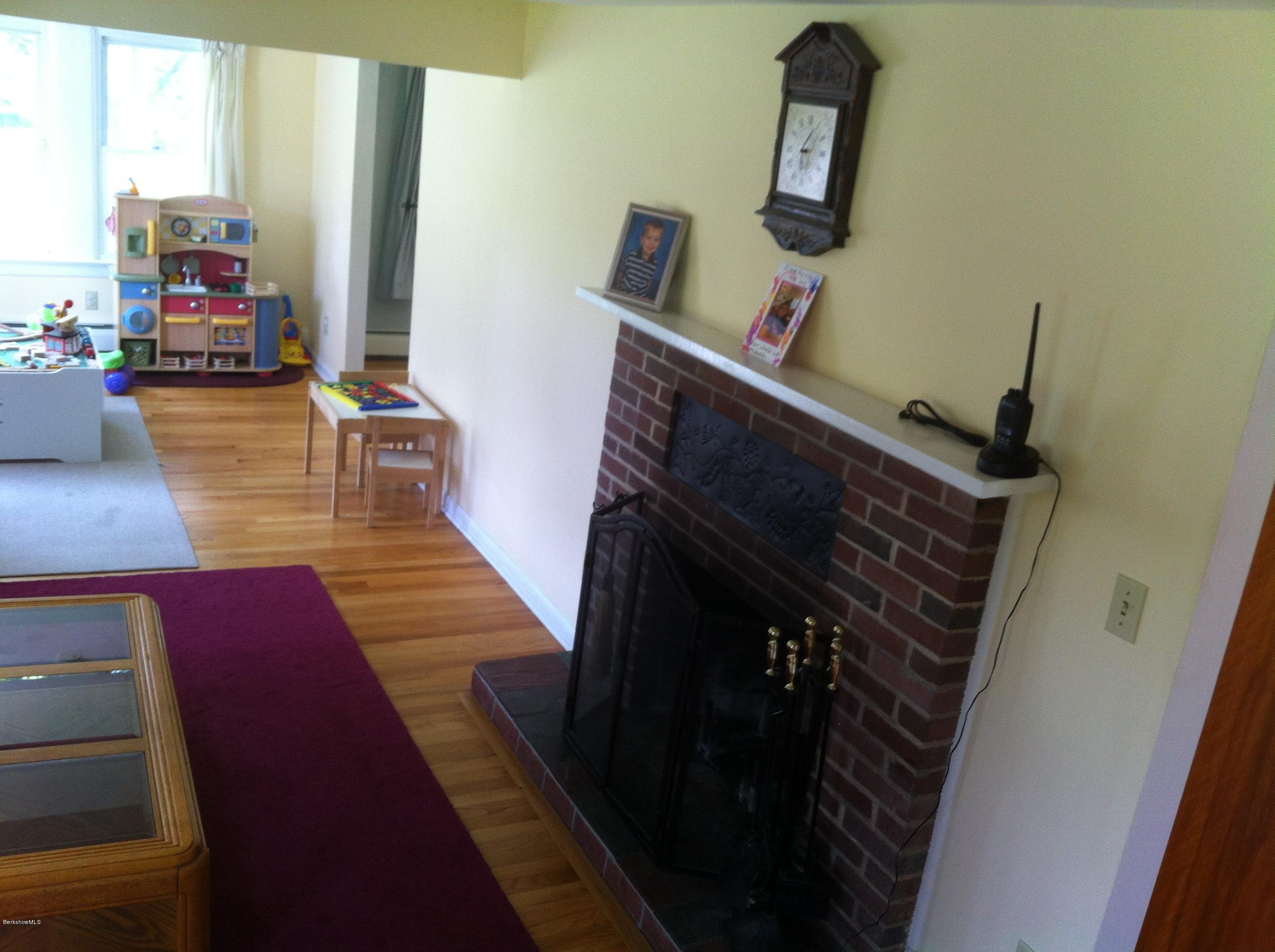 651 Lenox Road Richmond, MA 01254 - Photo 8 of 10 WOOD FLOORS AND FIREPLACE IN LIVING RM